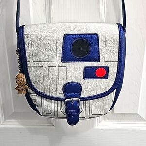 This fantastic R2-D2 metallic saddle bag is available from Box Lunch box.